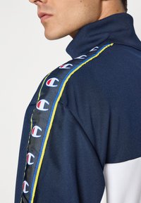 Champion SPORT HERITAGE TRACKSUIT SET - Treniņtērps - navy