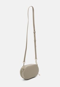 Gray oval crossbody bag made of faux leather, featuring a zipper closure, long adjustable strap, and gold-tone hardware accents.