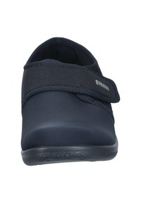 Black, soft slip-on shoe with a rounded toe, elastic strap, and textured sole. Constructed from smooth synthetic material for comfort.