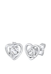 Sølvøreringe i hjerteform med lagde konturer og en klar ædelsten i midten af hvert hjerte. Poleret finish, minimalistisk design.