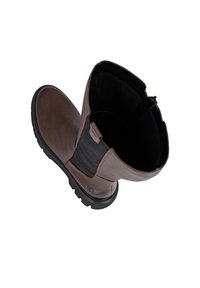 Brown leather ankle boot featuring a black elastic panel, round toe, and textured rubber sole. Interior shows soft lining.