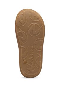 Suola di una scarpa, realizzata in gomma color tan, con una superficie testurizzata caratterizzata da motivi a logo circolari e il numero "20" in rilievo.