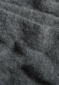 Gray textured fabric with a soft, fuzzy surface, featuring a slightly mottled appearance due to varying fiber lengths.