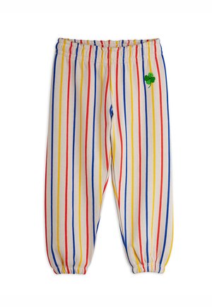 Striped cotton pants with elastic waistband. Vertical stripes in red, blue, yellow, and beige. Features green embroidered clover accent.
