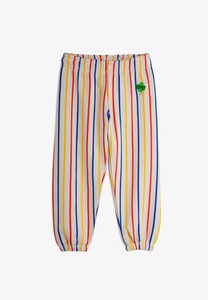 Striped cotton pants with elastic waistband. Vertical stripes in red, blue, yellow, and beige. Features green embroidered clover accent.