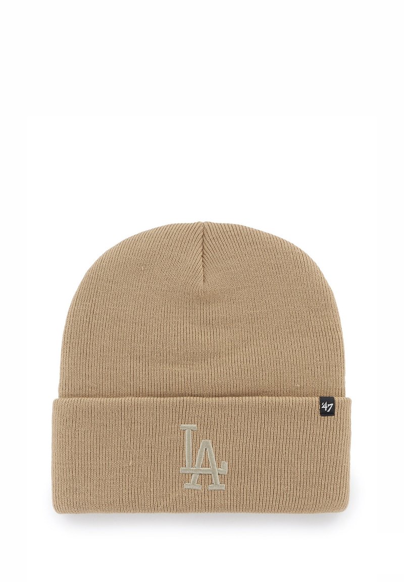 Beige knit beanie with a rolled cuff, featuring embroidered "LA" logo in light color and woven brand tag on the side.