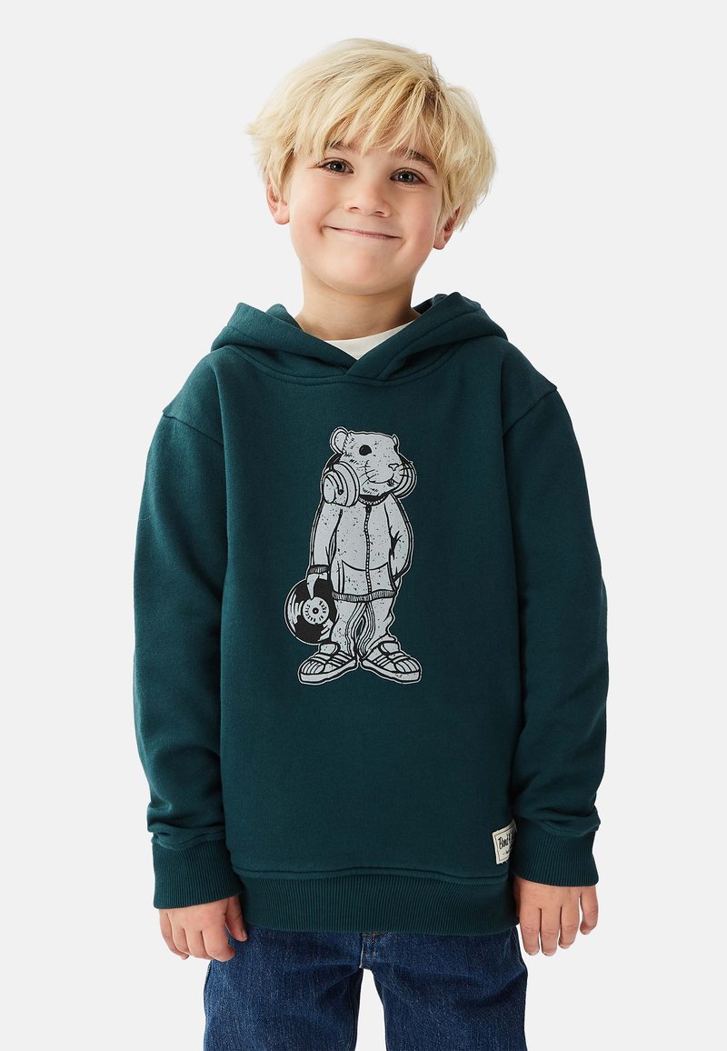 Mörkgrön hoodie med avslappnad passform, med en grafik av en björn som bär hörlurar och håller i en vinylskiva. Bomullsmaterial.