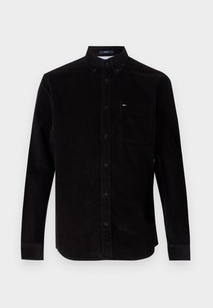 Zwarte corduroy overhemd met lange mouwen, button-down kraag en een voorzak. Heeft een subtiele textuur en een klein logo op de zak.