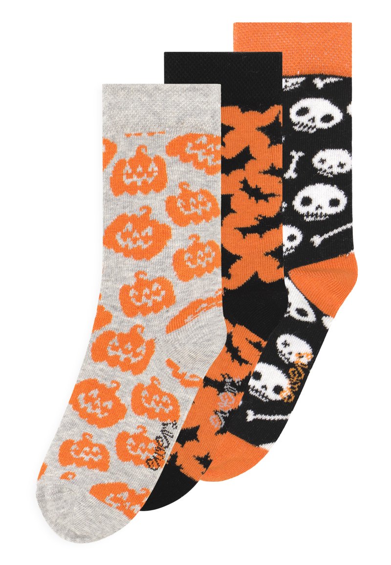 Three pairs of socks featuring Halloween designs: gray with orange pumpkins, orange with black bats, and black with white skulls and bones.