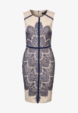 Hame injin, bežové barvy, s námořnickou modrou krajkou. Má přiléhavý střih, kulatý výstřih a uzavření na zip na zadní straně.