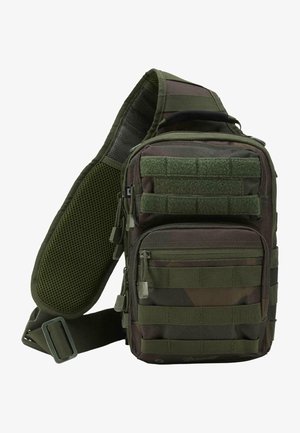 Grüner Tarn-Sling-Rucksack mit mehreren Reißverschlusstaschen, einem verstellbaren Gurt und einem Netzrückenpaneel zur Belüftung.