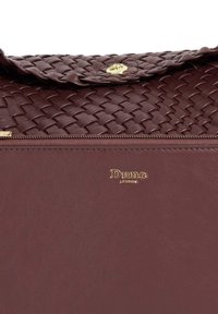 Burgundy handbag featuring a woven top flap, smooth leather body, gold logo detailing, and a zip closure along the bottom edge.