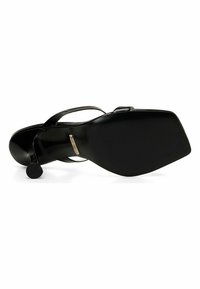Black high-heeled sandal with a rounded toe, smooth leather upper, thin straps, and a textured flat sole. Accented with a small circular heel.