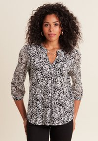 Schwarz-weiße Bluse mit floralem Muster, mit einem Schlüssellochausschnitt, dreiviertellangen Puffärmeln und einer glatten, durchsichtigen Textur.