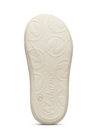 Suola di scarpa in gomma di colore avorio con motivi circolari e marchio. La texture è liscia con un design leggermente in rilievo.