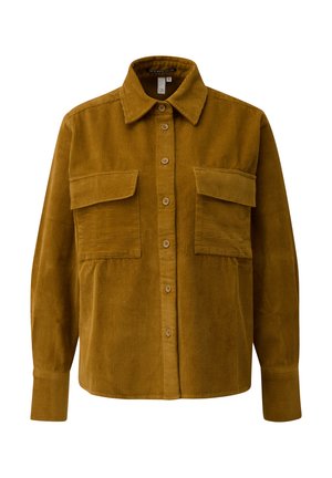 Bruine corduroy shirt met een knoopsluiting aan de voorzijde, puntkraag en twee borstzakken; heeft een verticale ribbeltextuur en lange mouwen.