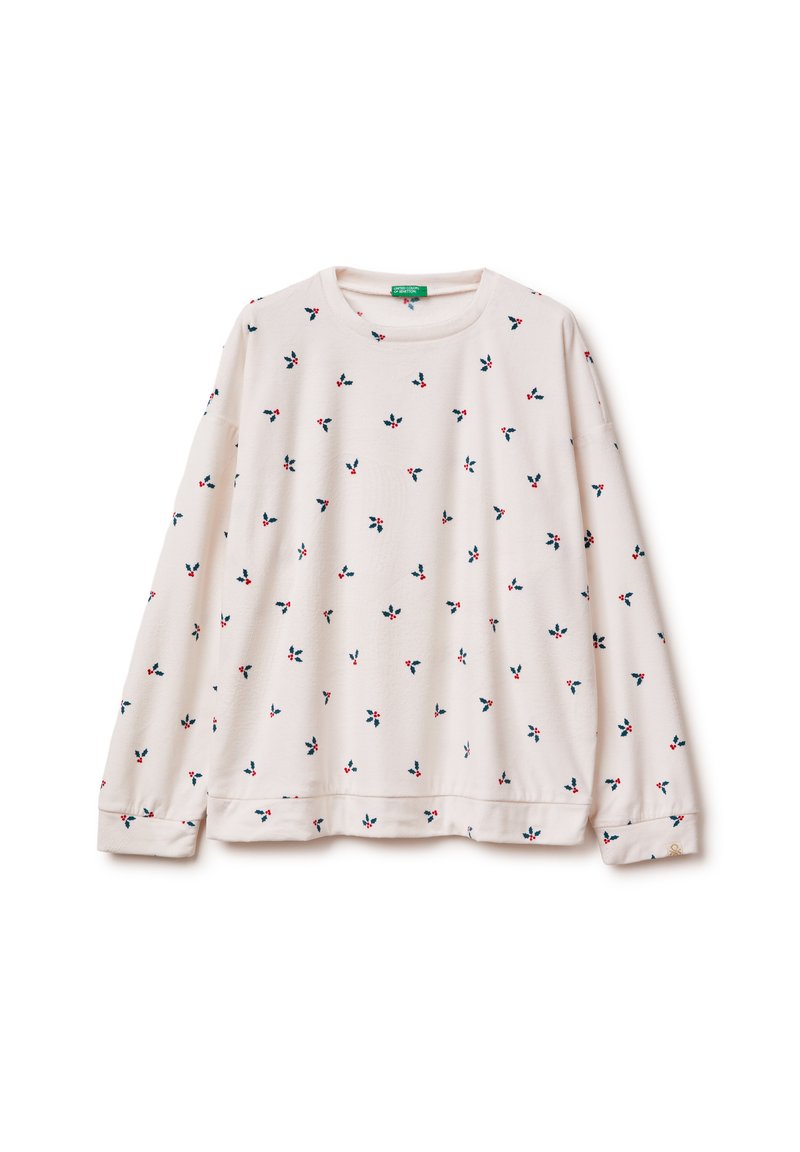 Jasnoróżowa bluza z kwiatowym wzorem w kolorach granatowym i czerwonym, okrągłym dekoltem oraz długimi rękawami zakończonymi mankietami.