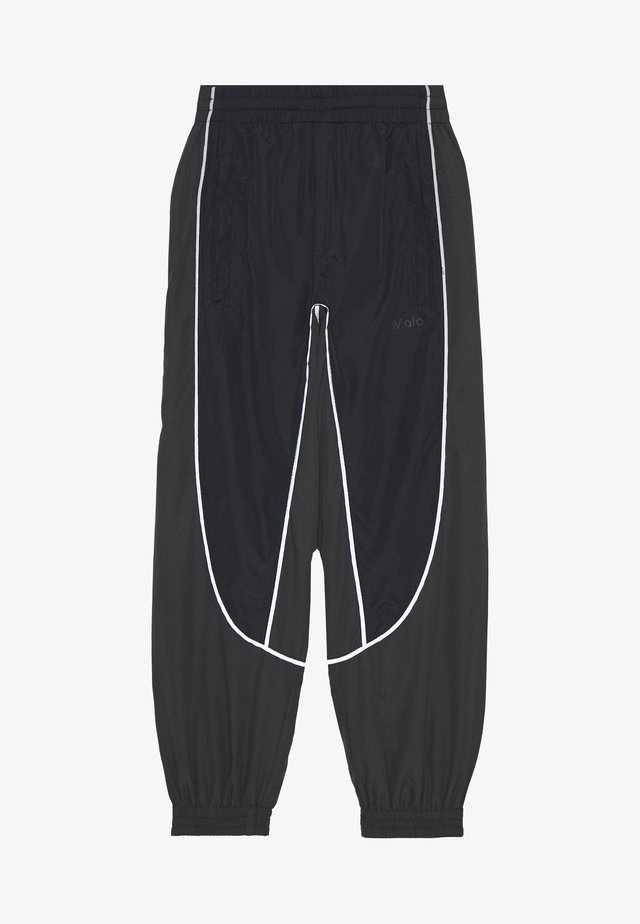 ARKUU - Tracksuit bottoms - black