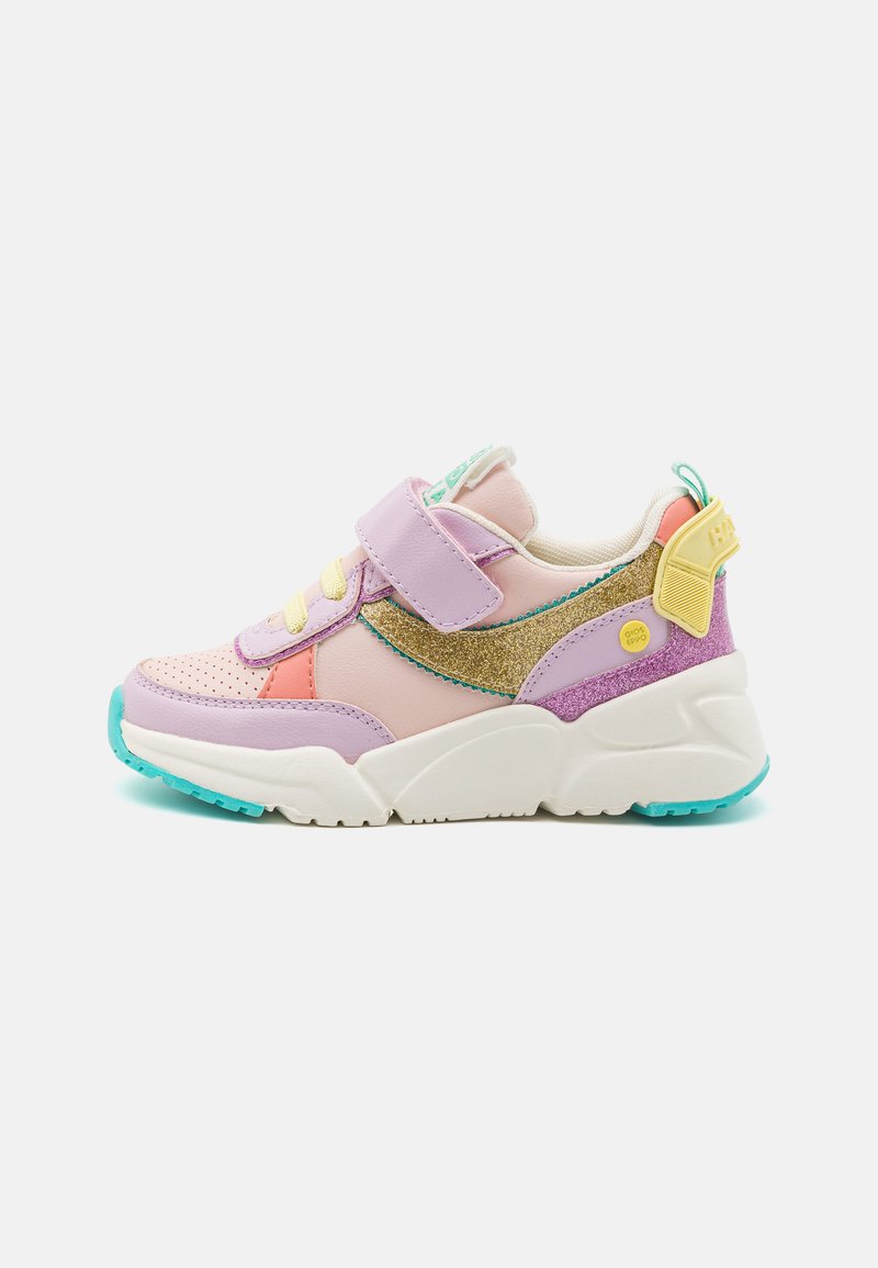 Colorful sneaker featuring a mix of pink, purple, and gold materials, velcro strap, mesh accents, and a thick white midsole with turquoise details.