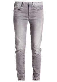 Grå denimjeans med slim fit, femficksdesign och subtila blekningar för textur. Avslutade med en vanlig knapp och dragkedja.