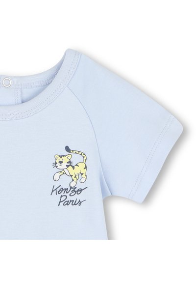 T-shirt en coton bleu clair avec un graphique de tigre jaune agrémenté de accents noirs et le texte « Kenzo Paris » en dessous du design.
