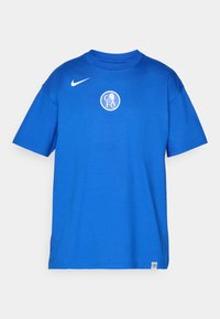 Blå bomulds t-shirt med rund halsudskæring, korte ærmer og et hvidt cirkulært logo på brystet. Nike swoosh i hvidt på venstre skulder.