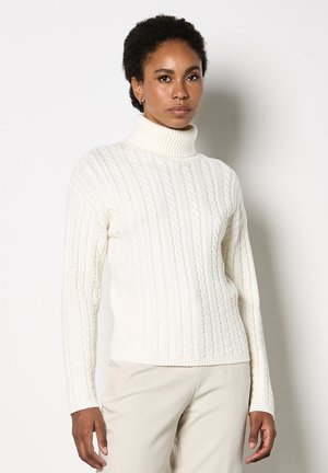 Maglione a collo alto in lavorazione a treccia di colore crema, con polsini e orlo a costine, realizzato in un morbido misto lana. Caratterizzato da maniche lunghe e design aderente.