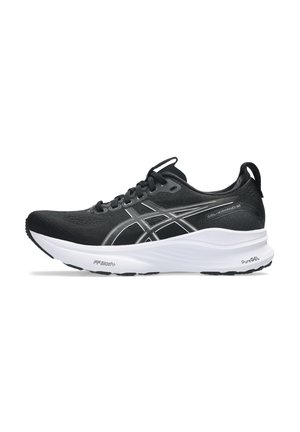 Black running shoe with a breathable mesh upper, silver accents, subtle logo, and a thick white midsole for cushioning. Black rubber outsole.