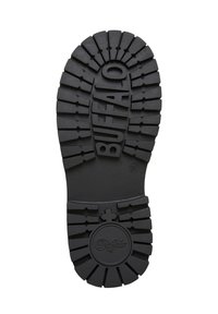 Semelle de chaussure en caoutchouc noir avec des motifs de crampons profonds, comportant des lettres en relief "BUFFALO" et un logo circulaire au centre inférieur.