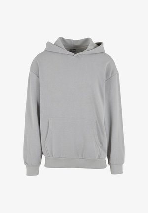 Siva kapuca pulover narejen iz mehkega blaga, z sprednjim žepom, rebrastimi manšetami in robom, sproščenega kroja in brez vidnih vzorcev.