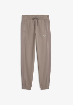 Spodnie dresowe marki Puma w kolorze taupe, z elastycznym pasem, sznurkiem, bocznymi kieszeniami, białym logo na prawej nodze i zwężanymi elastycznymi mankietami.
