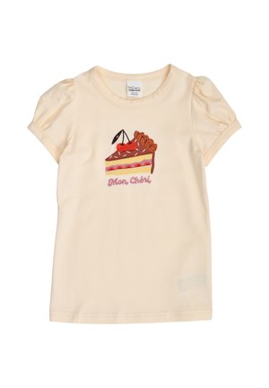 Chemise crème à manches courtes pour fille avec manches bouffantes, brodée d'un gâteau surmonté d'une cerise et le texte «Mon Chéri» en dessous.