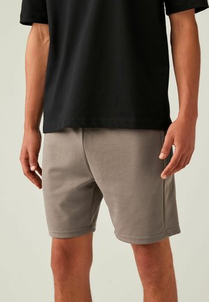 REGULAR FIT - Pantaloni de trening - neutral