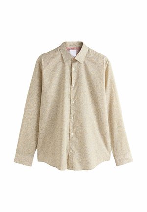 Pitkähihainen paita, valmistettu kevyestä kankaasta, jossa on vaaleankeltainen tausta ja pieniä, monivärisiä kukkakuvioita sekä etupuolella napillinen suljenta.