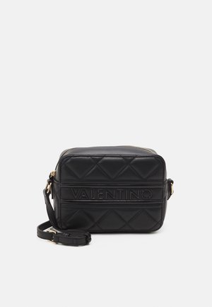 Black quilted leather handbag with a rectangular shape, featuring a zipper closure, embossed "VALENTINO" logo, and an adjustable strap.