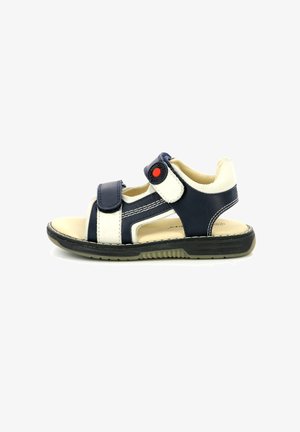 Sandalo per bambini blu navy e crema con due cinturini in velcro regolabili, suola in gomma e un bottone rosso di accento sul cinturino.