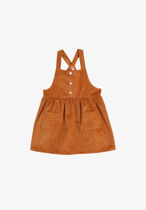 Vestido de pana en naranja quemado con tirantes cruzados ajustables, botones en la parte delantera y dos grandes bolsillos en la falda. Tela texturada con patrón acanalado.