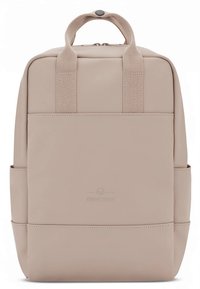 Beige backpack with a smooth, matte finish. Features two top handles, a zip closure, and side pockets. Subtle logo on front.