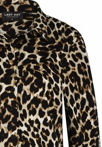 Luipaardprint overhemd met zwarte knopen, met een kraag en een label met de tekst "Lady Day Amsterdam S."