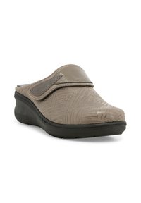 Scarpa slip-on in tessuto beige con superficie testurizzata, suola in gomma nera e cinturino regolabile. Presenta un delicato motivo geometrico e punta arrotondata.