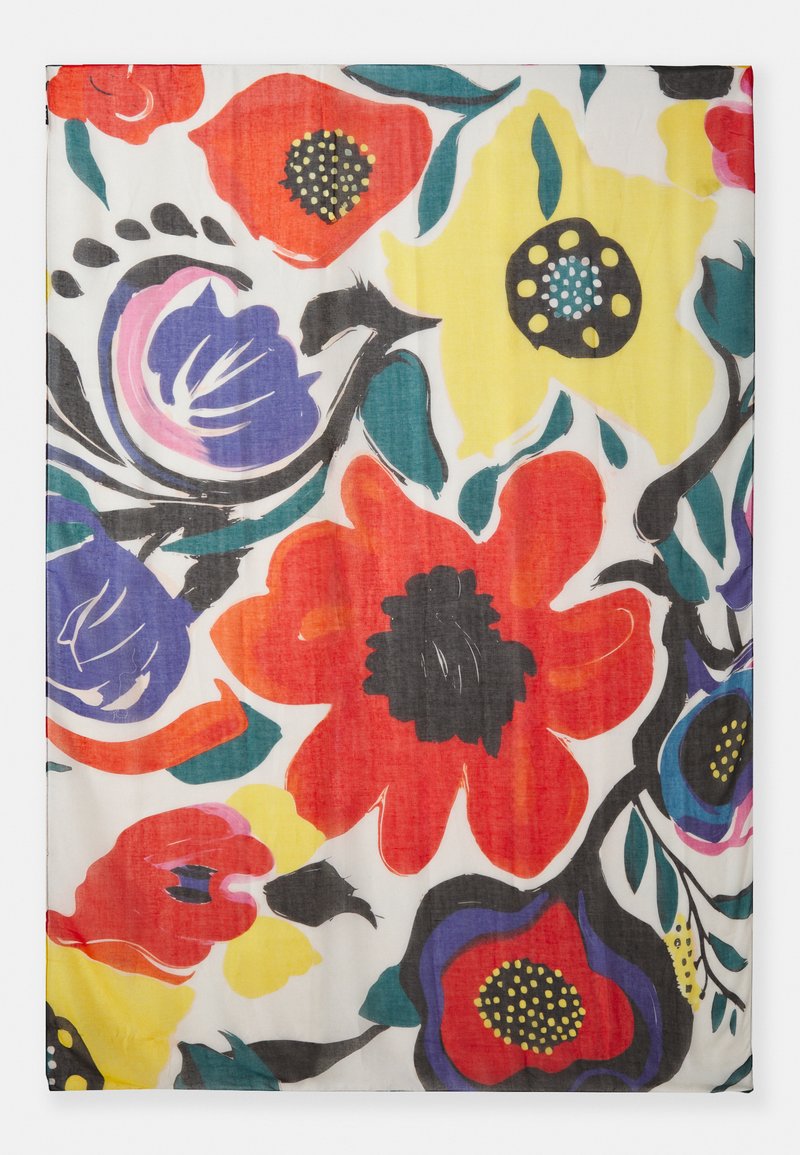 Tissu avec un imprimé floral multicolore présentant de grandes fleurs rouges et jaunes, des feuilles vertes et des accents noirs sur un fond blanc. Texture légère.