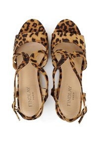 Leopard print high-heeled sandals with suede texture, wide straps, and ankle ties. Interior features "FINDLAY PARIS" embossed on the insole.
