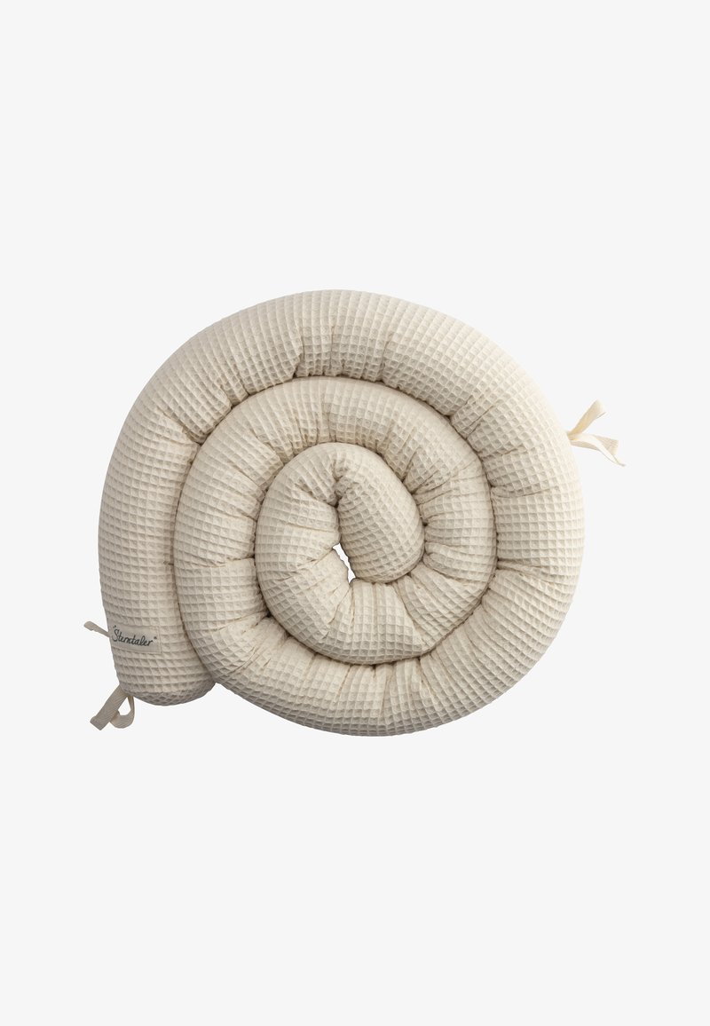 Rolled beige pillow with a textured, quilted fabric surface, featuring ribbon ties at one end for secure attachment.