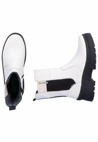 White ankle boots with a smooth leather finish, textured side panels, and black rubber soles. Features a pull tab and elastic gore for fit.