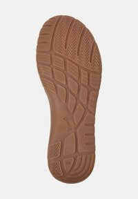Suola di scarpa in gomma marrone con un battistrada decorato, forma arrotondata e il nome del marchio "Camper" in rilievo, con la taglia "38" visualizzata.
