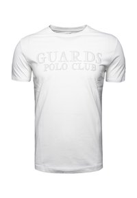 Camiseta de algodón blanca con mangas cortas y cuello redondo, con una sutil impresión en gris que dice "GUARDS POLO CLUB" en el frente.