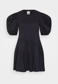 Black puff-sleeve dress featuring a tiered design, with a smooth top portion and gathered texture in the skirt. Made from lightweight fabric.