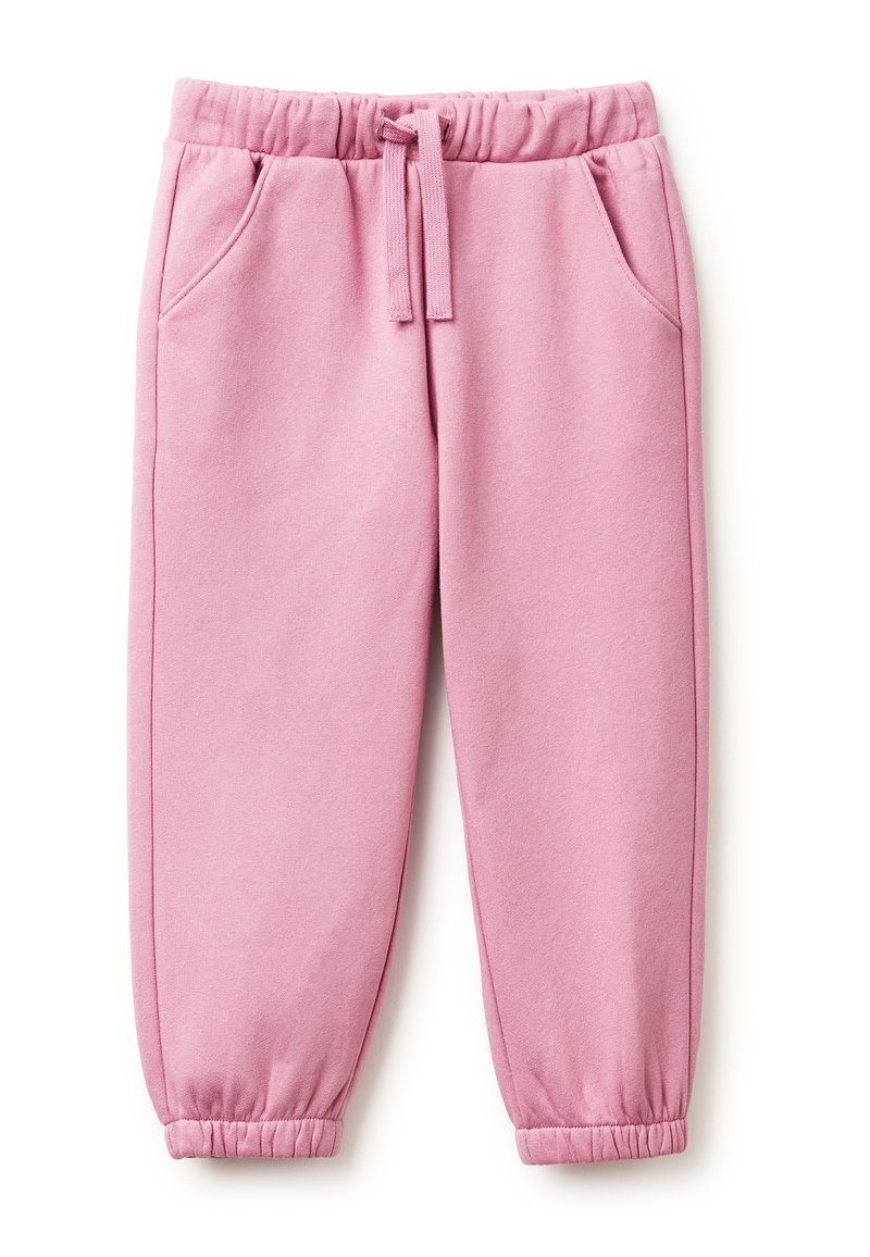 Růžové bavlněné tepláky s elastickým pasem, stahovací šňůrkou, bočními kapsami a úzkými manžetami na kotnících. Hladký povrch.