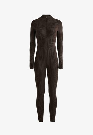 Temno rjav rebrast pleteni kombinezon z dolgimi rokavi, visokim ovratnikom, sprednjim zadrgo in luknjami za palce na manšetah.