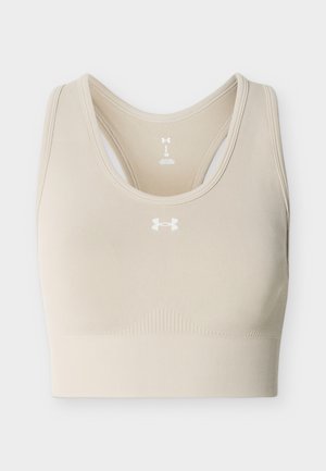 Beige Under Armour saumaton urheiluliivit racerback-muotoilulla ja rintakehän keskelle sijoitetulla logolla.